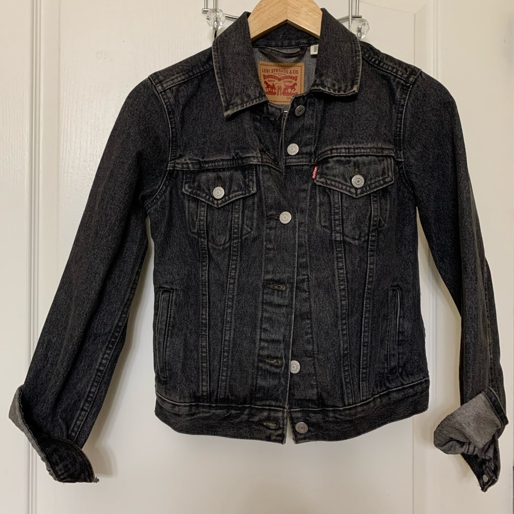 Levi’s jean jacket . Black acid washed . REAL POCKETS !